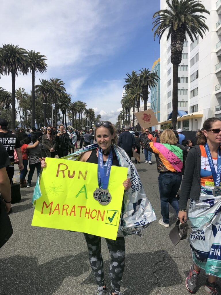 Stephanie David celebrating the completion of a marathon